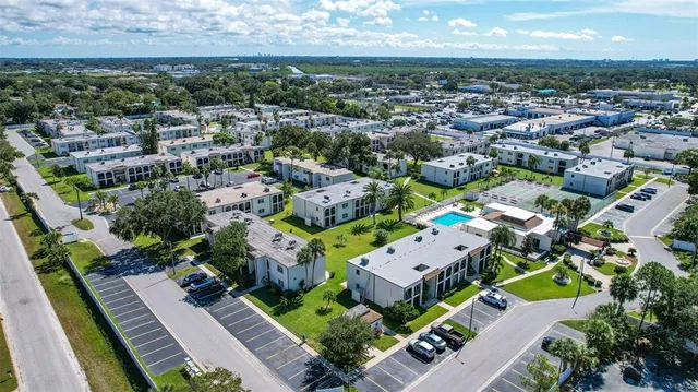 an aerial view of residential houses with outdoor space