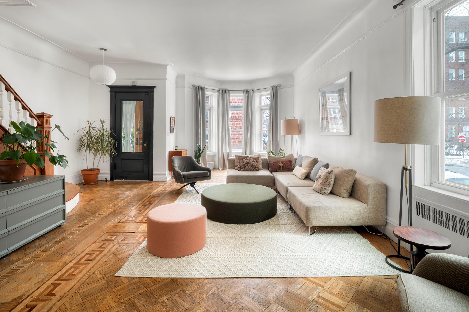 a living room with furniture and a lamp