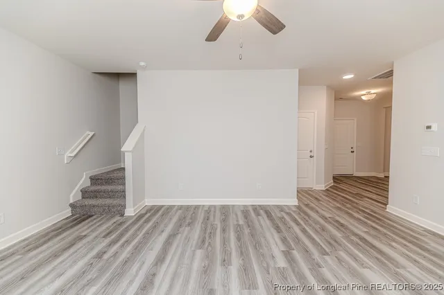 a view of a livingroom with wooden floor
