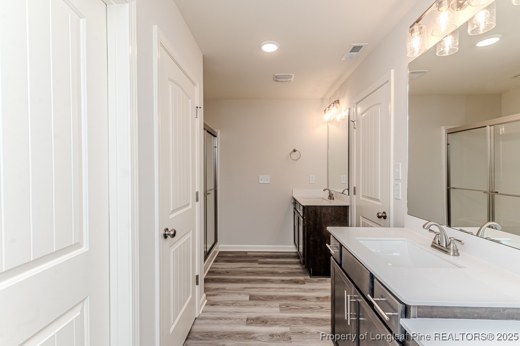 87 Onslow Court Spring Lake, NC 28390 - Photo 19 of 32 a bathroom with a sink and a mirror