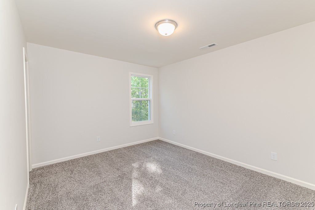 87 Onslow Court Spring Lake, NC 28390 - Photo 22 of 32 an empty room with windows
