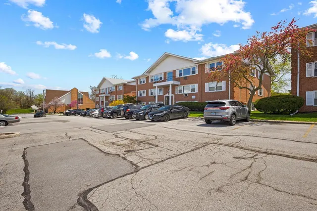 a city street lined with buildings and cars