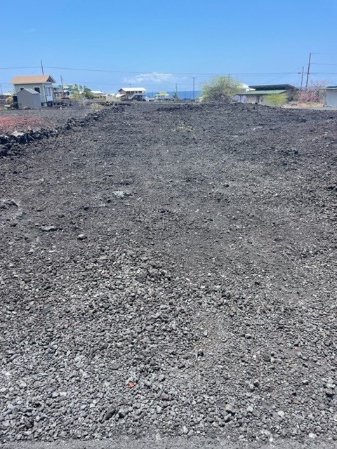 30 Ehiku Avenue Captain Cook, HI 96704 - Photo 5 of 7 a view of a dry yard with trees in the background