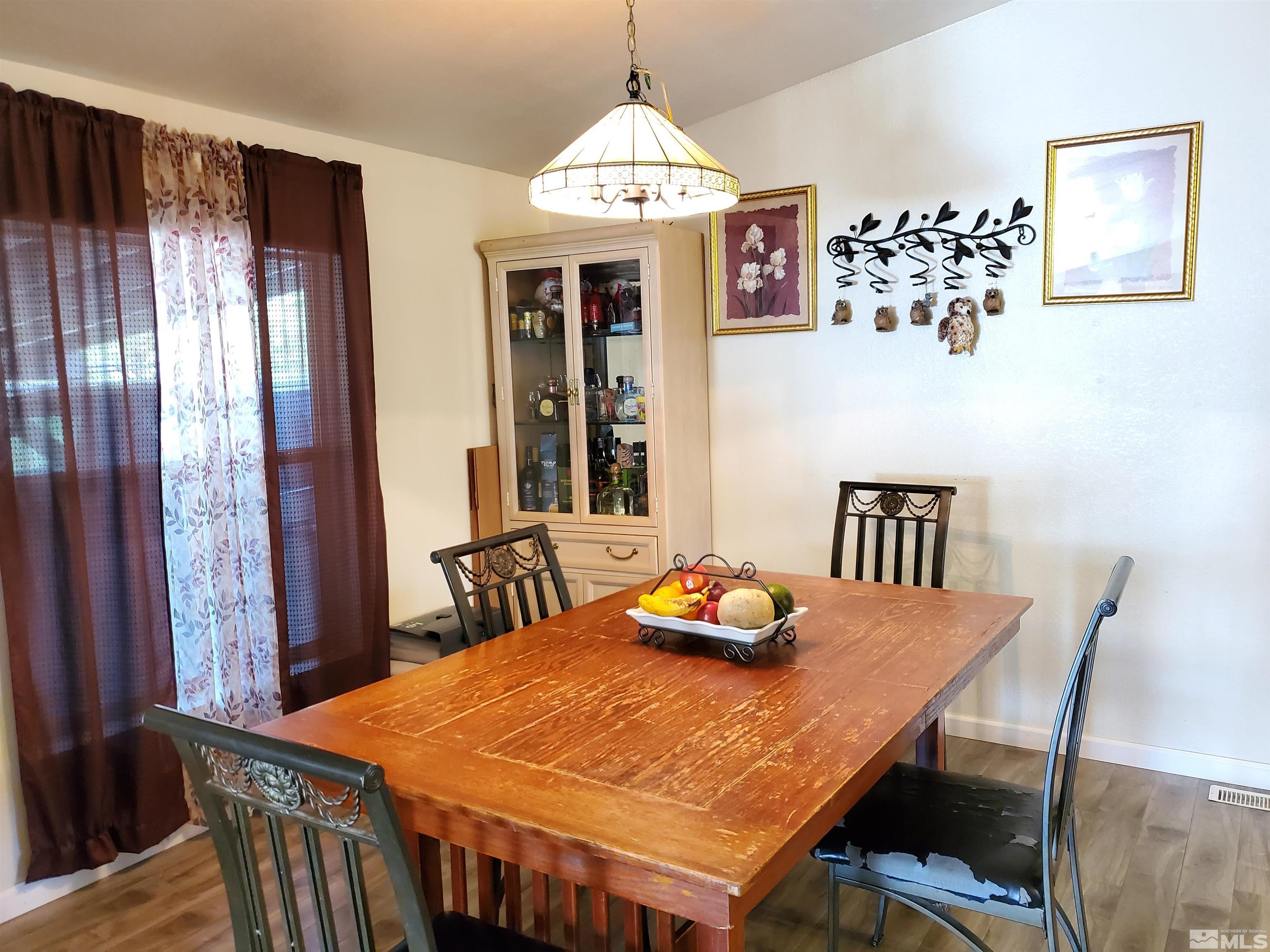 1356 Lynx Street Reno, NV 89506 - Photo 11 of 16 a dining room with a table and chairs