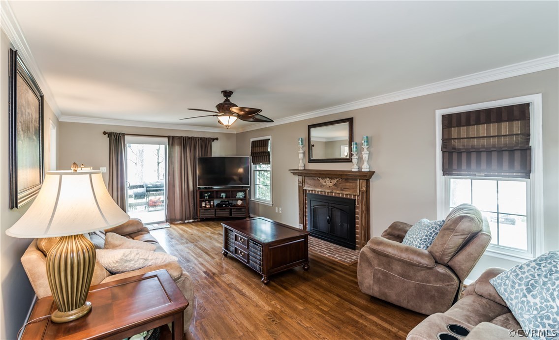 4824 Cedar Cliff Road Chester, VA 23831 - Photo 11 of 50 a living room with furniture a flat screen tv and a fireplace