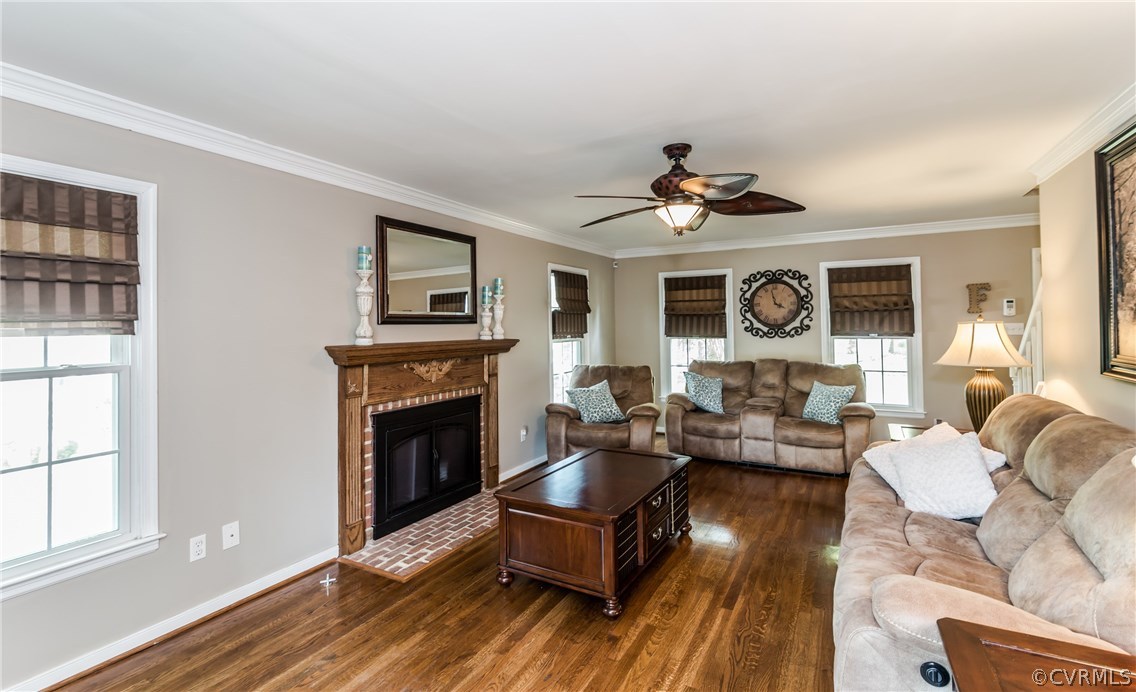 4824 Cedar Cliff Road Chester, VA 23831 - Photo 15 of 50 a living room with furniture fireplace and a window