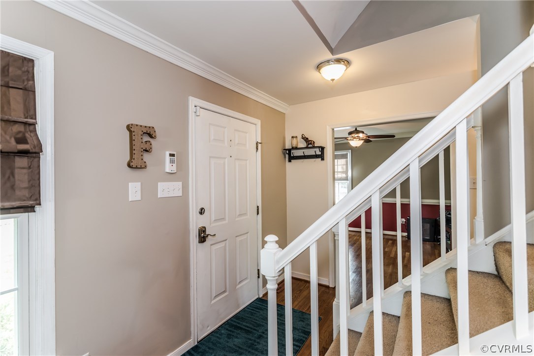 4824 Cedar Cliff Road Chester, VA 23831 - Photo 17 of 50 a view of staircase with lots of frames on wall and wooden floor