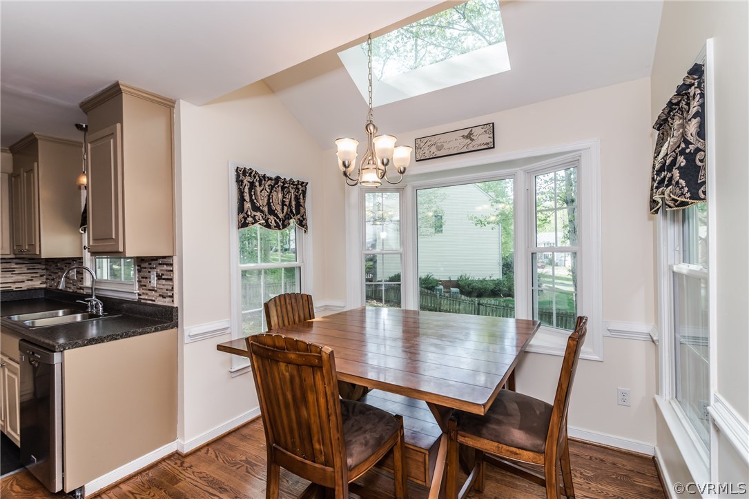 4824 Cedar Cliff Road Chester, VA 23831 - Photo 24 of 50 a dining room with furniture a chandelier and wooden floor