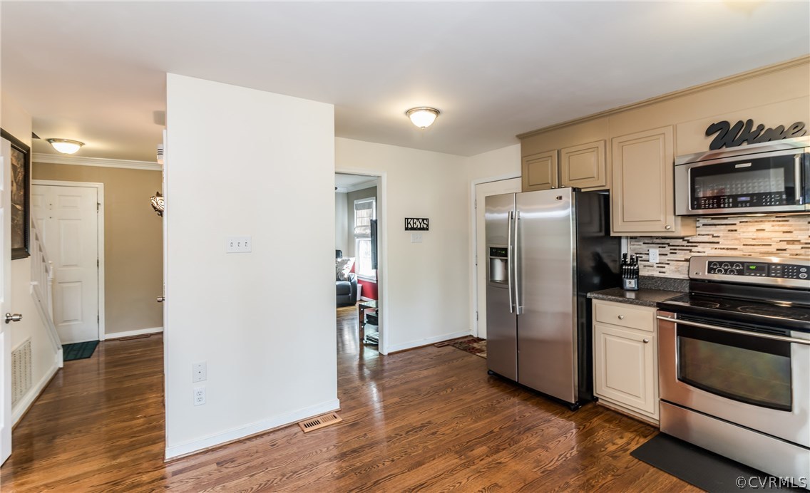 4824 Cedar Cliff Road Chester, VA 23831 - Photo 25 of 50 a kitchen with a refrigerator and a stove top oven