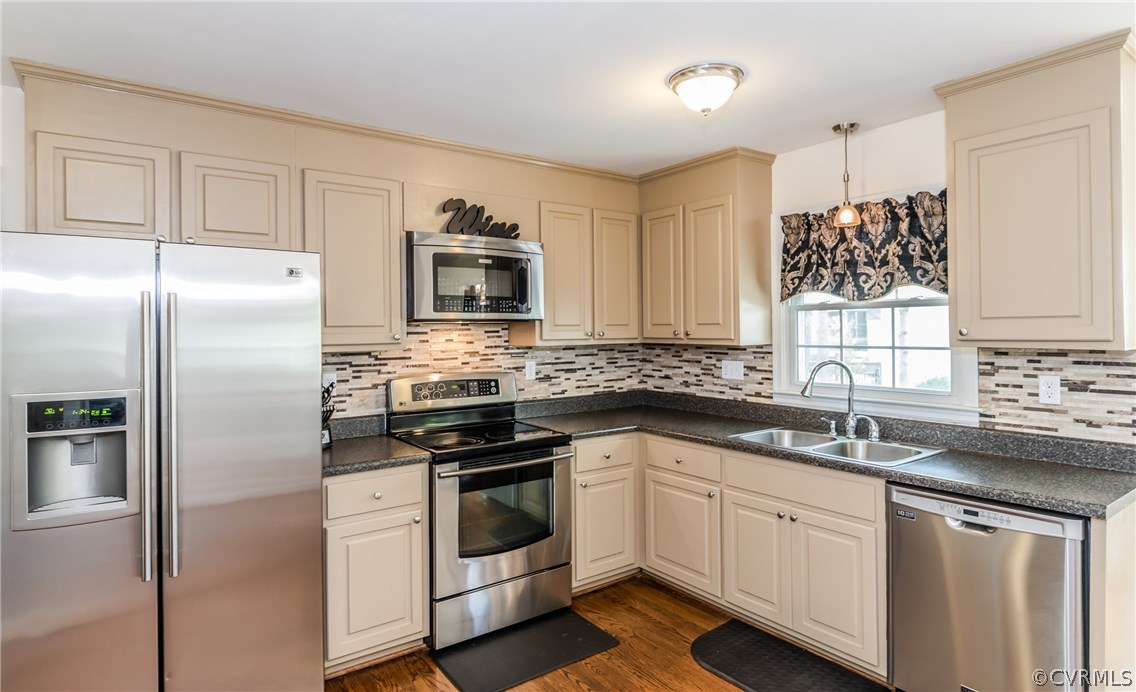 4824 Cedar Cliff Road Chester, VA 23831 - Photo 28 of 50 a kitchen with a sink stove and refrigerator