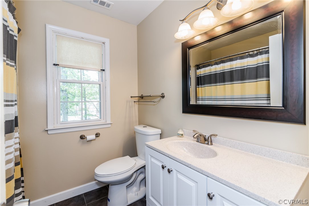 4824 Cedar Cliff Road Chester, VA 23831 - Photo 34 of 50 a bathroom with a toilet sink and mirror