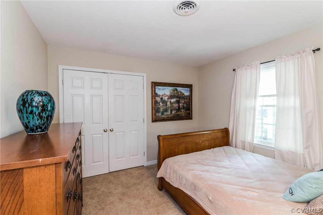 4824 Cedar Cliff Road Chester, VA 23831 - Photo 35 of 50 a bedroom with a bed and a window
