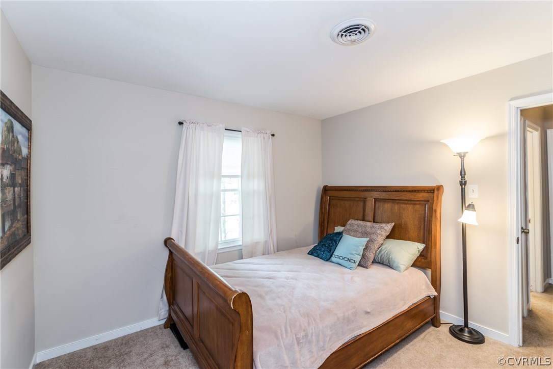 4824 Cedar Cliff Road Chester, VA 23831 - Photo 36 of 50 a bedroom with a bed and a window