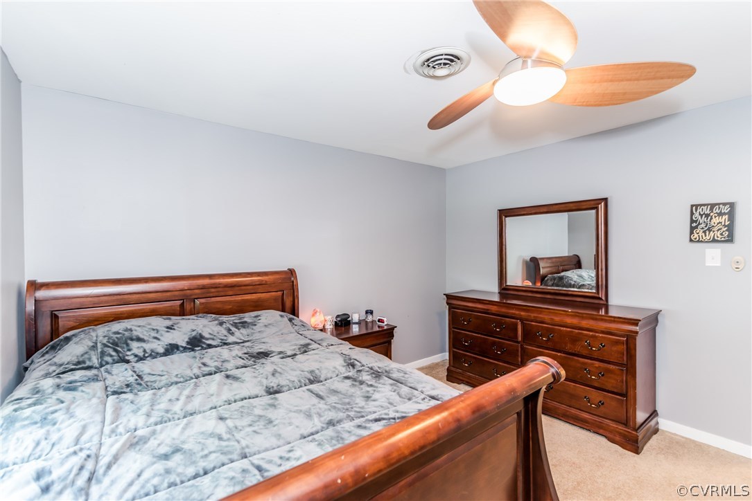 4824 Cedar Cliff Road Chester, VA 23831 - Photo 38 of 50 a bedroom with a bed and a dresser