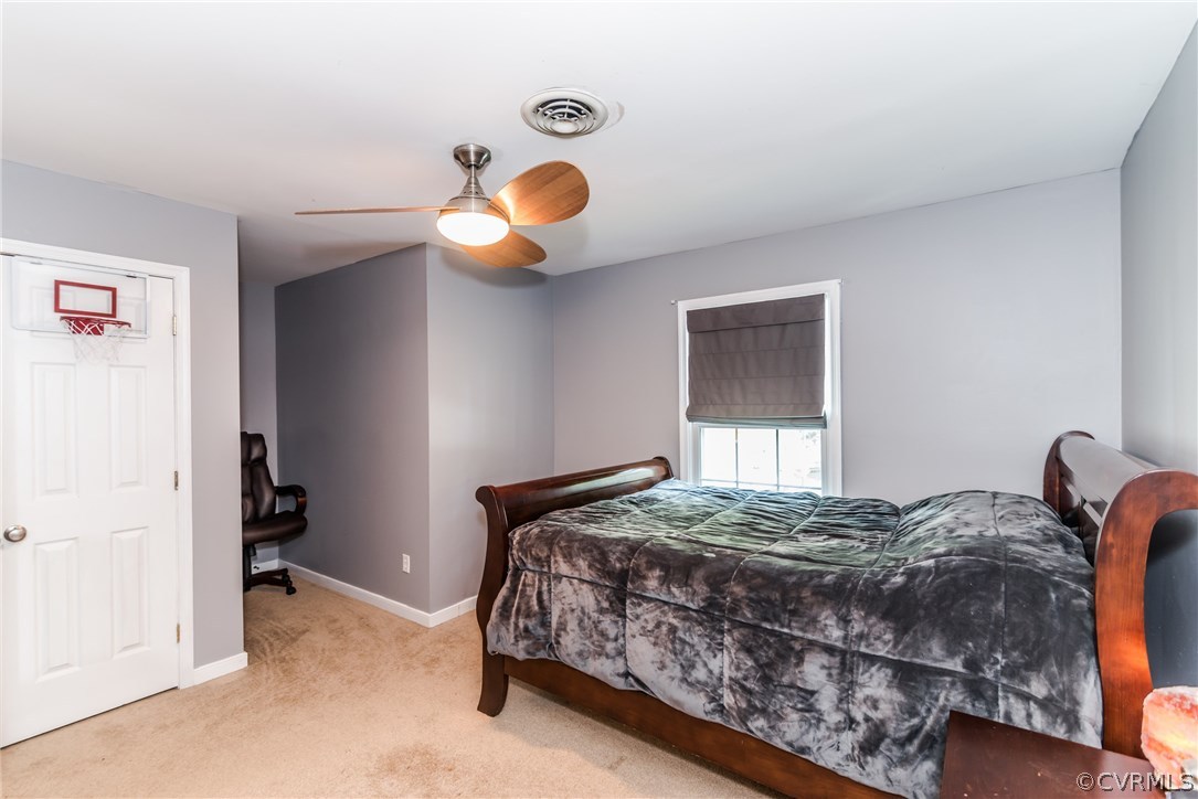 4824 Cedar Cliff Road Chester, VA 23831 - Photo 40 of 50 a bedroom with a bed and window