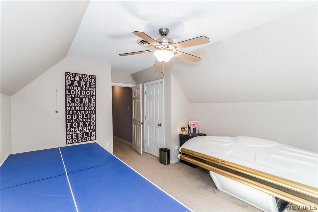 4824 Cedar Cliff Road Chester, VA 23831 - Photo 41 of 50 a bedroom with a bed and a chandelier