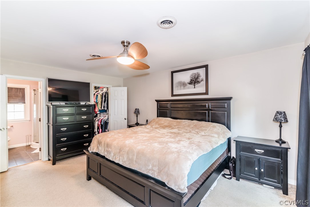 4824 Cedar Cliff Road Chester, VA 23831 - Photo 45 of 50 a bedroom with a bed and wooden floor