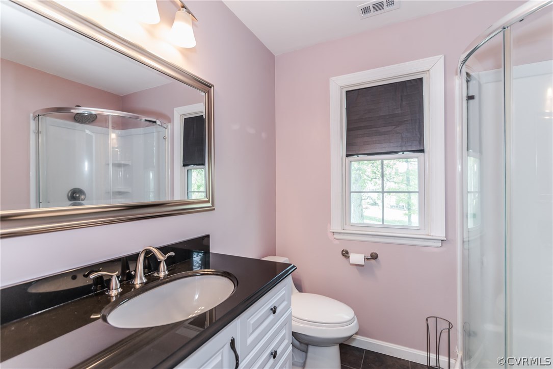 4824 Cedar Cliff Road Chester, VA 23831 - Photo 48 of 50 a bathroom with a granite countertop sink toilet a mirror and shower