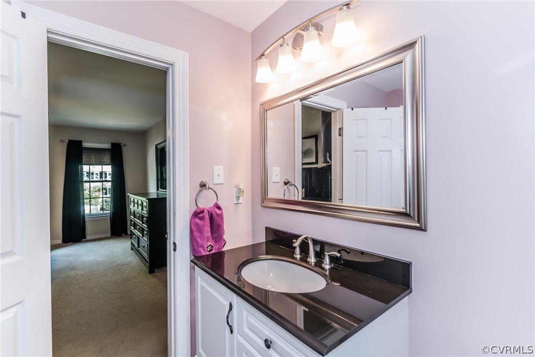 4824 Cedar Cliff Road Chester, VA 23831 - Photo 49 of 50 a en suite bathroom with a sink and a mirror