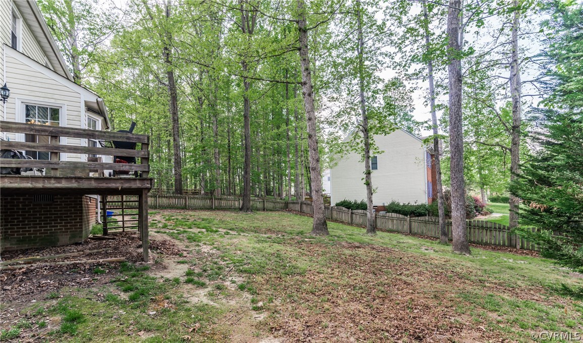 4824 Cedar Cliff Road Chester, VA 23831 - Photo 10 of 50 a backyard of a house with lots of green space