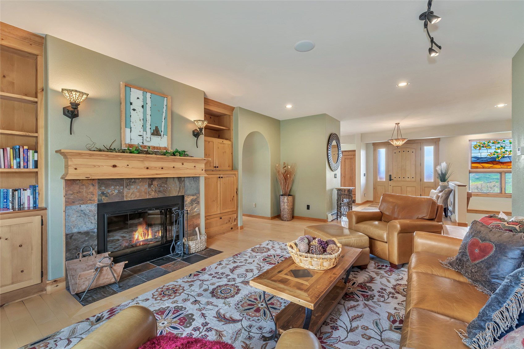 31485 Deerwood Ranch Road Steamboat Springs, CO 80487 - Photo 32 of 49 a living room with furniture fireplace and rug