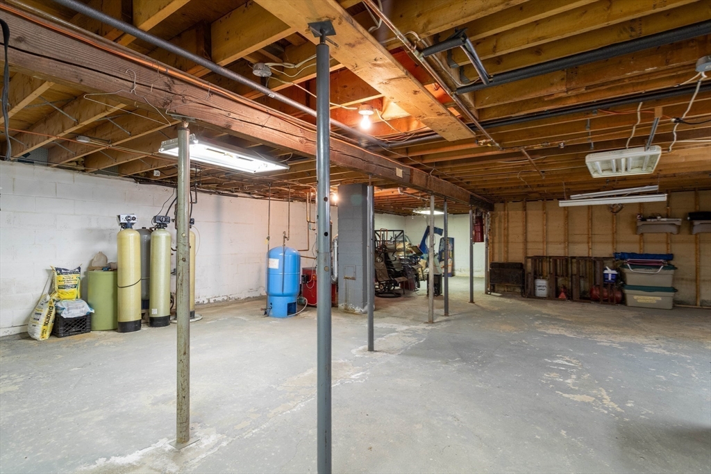 118 Spring Hill Road Ashby, MA 01431 - Photo 20 of 37 a view of a garage with red white cabinets