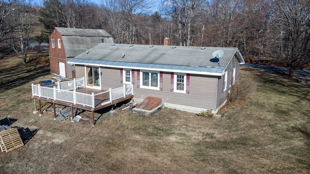 118 Spring Hill Road Ashby, MA 01431 - Photo 31 of 37 aerial view of a house with a yard and sitting area
