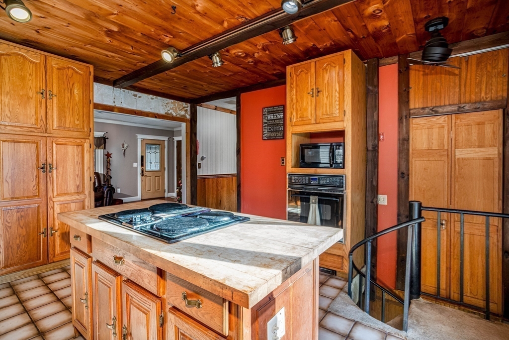 118 Spring Hill Road Ashby, MA 01431 - Photo 7 of 37 a kitchen that has a table and chairs in it