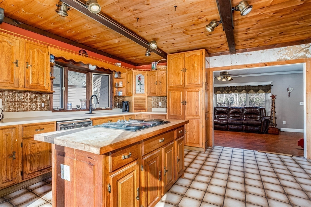 118 Spring Hill Road Ashby, MA 01431 - Photo 9 of 37 a view of a kitchen with a sink and cabinets