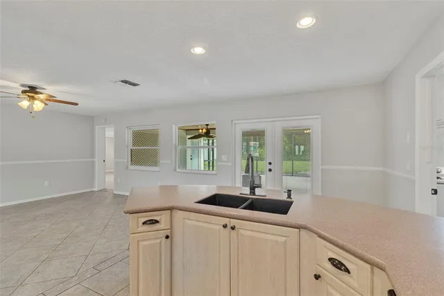 a kitchen with a sink and cabinets