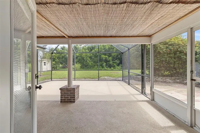 a view of a room with porch and garden