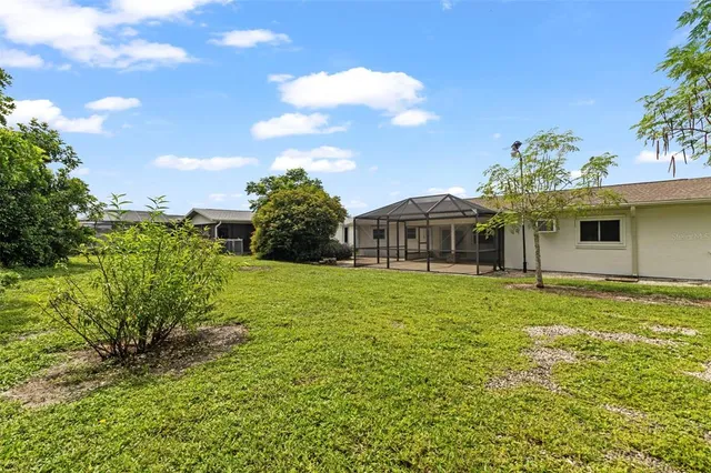 a view of a backyard with green space