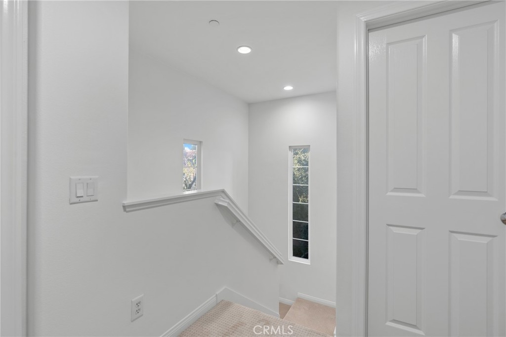 55 Bower Tree Irvine, CA 92603 - Photo 13 of 32 a view of a hallway with staircase
