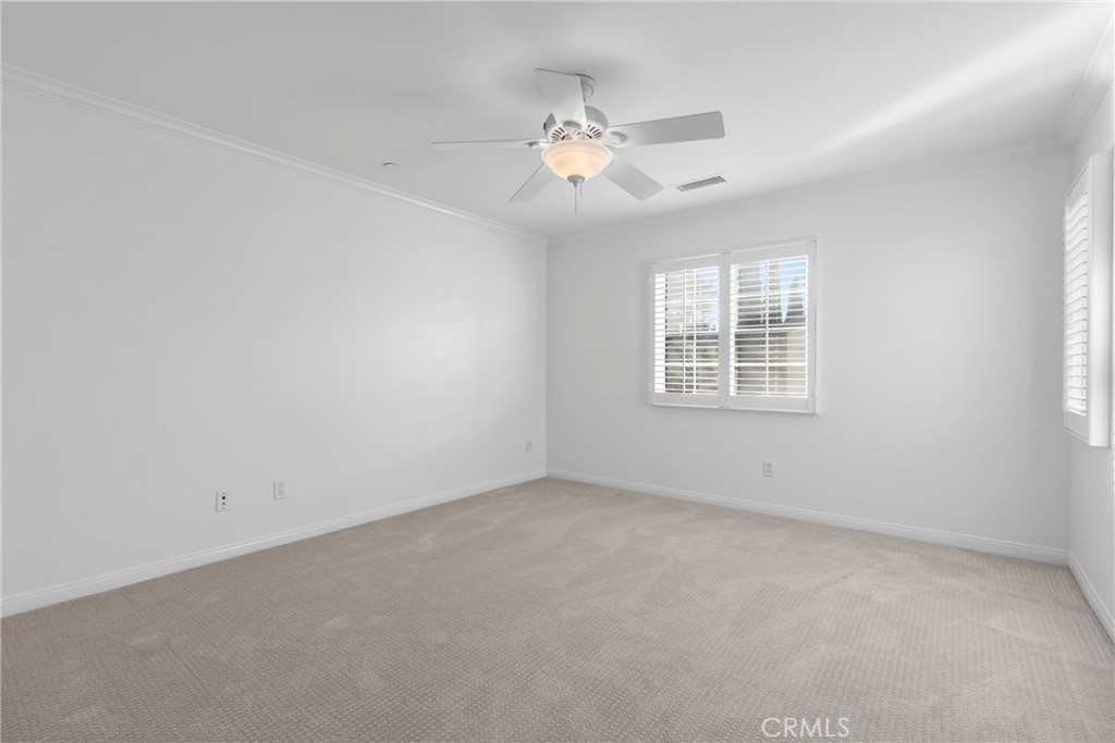 55 Bower Tree Irvine, CA 92603 - Photo 14 of 32 en empty room with windows and ceiling fan