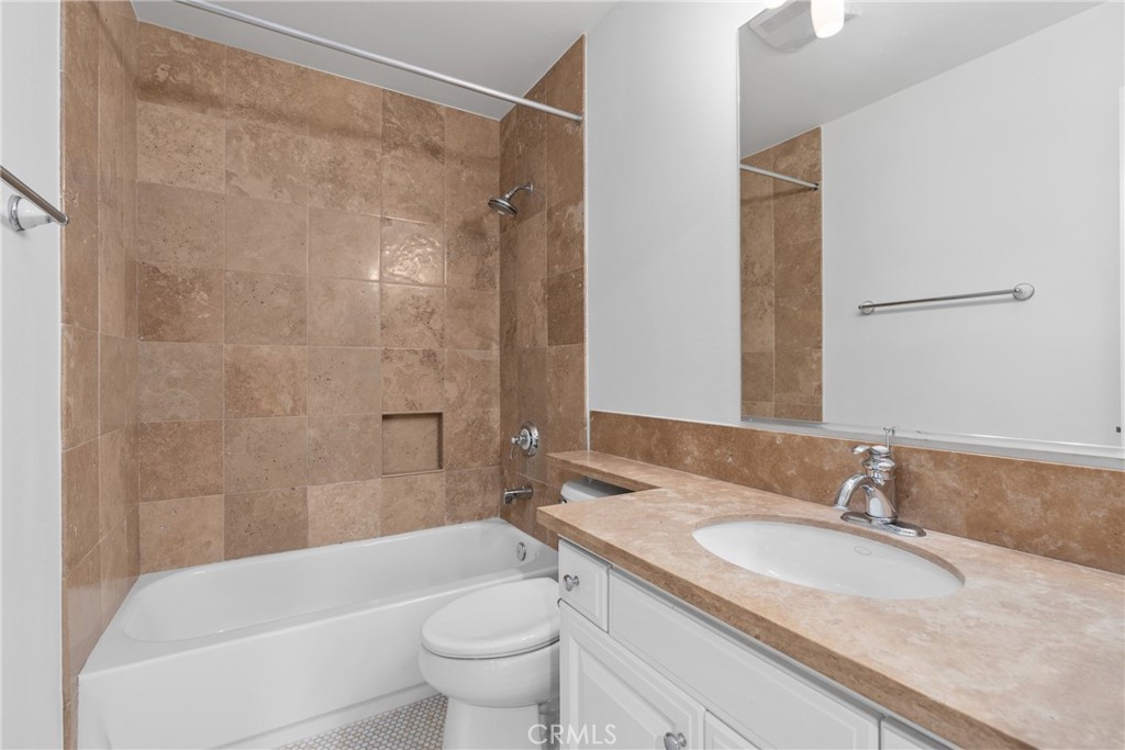 55 Bower Tree Irvine, CA 92603 - Photo 19 of 32 a bathroom with a granite countertop sink toilet and shower