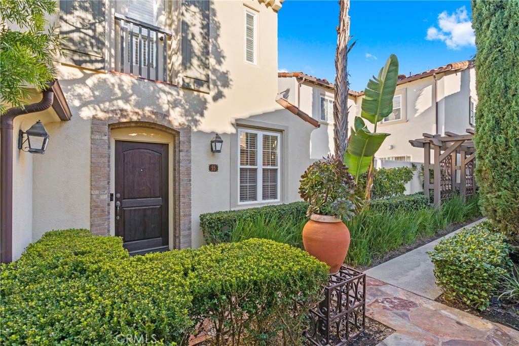 55 Bower Tree Irvine, CA 92603 - Photo 2 of 32 a view of a chair and table in the backyard of the house