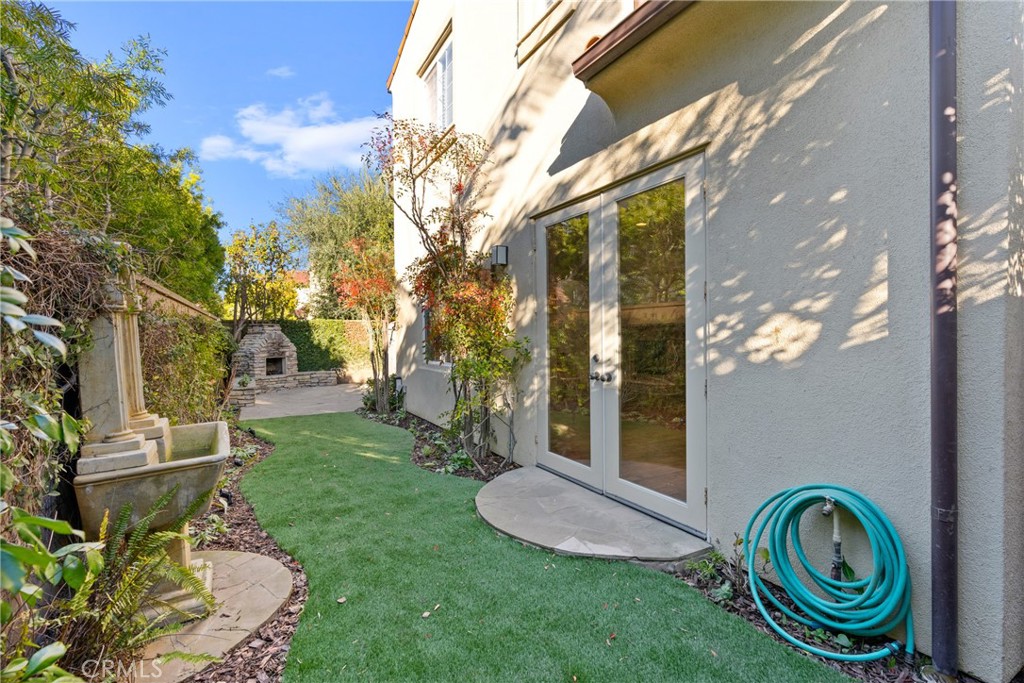 55 Bower Tree Irvine, CA 92603 - Photo 25 of 32 a view of a pathway of a house with backyard