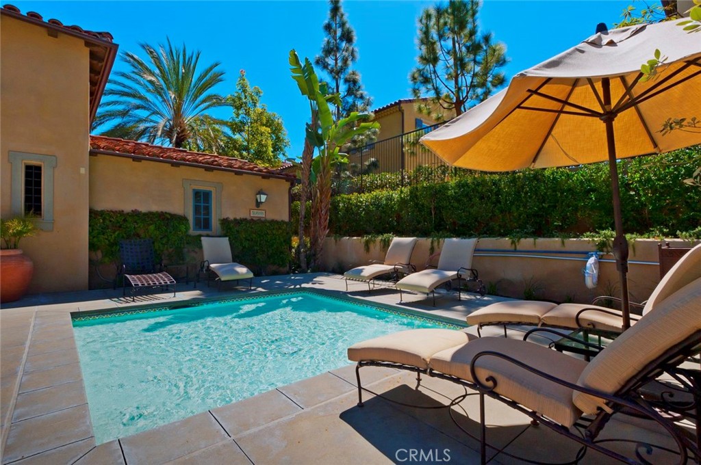 55 Bower Tree Irvine, CA 92603 - Photo 28 of 32 a view of a backyard with sitting area