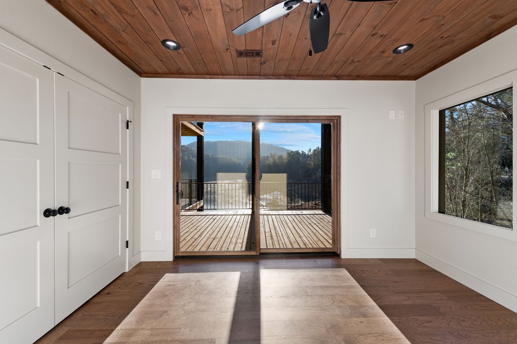 770 Fish Hook Point Blue Ridge, GA 30513 - Photo 64 of 96 2nd Lower Level Guest Bedroom 3, Guest Bedroom 3 with walk out deck access to Deck & Lake