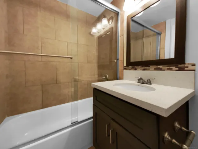 a view of a kitchen with a sink and a stove top oven