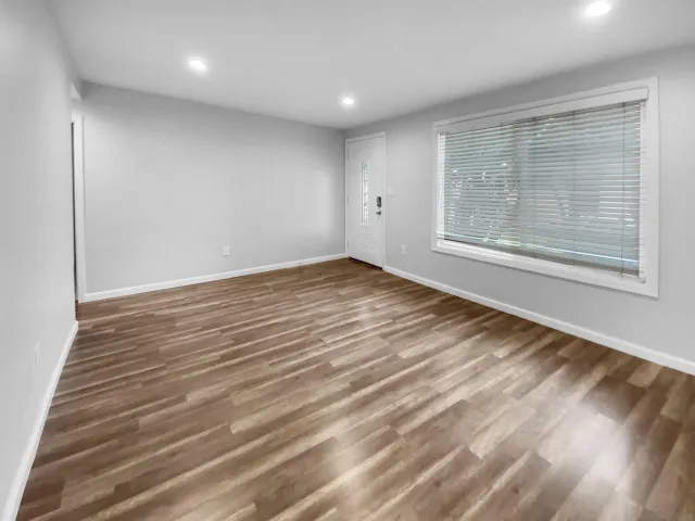 a view of an empty room and closet area