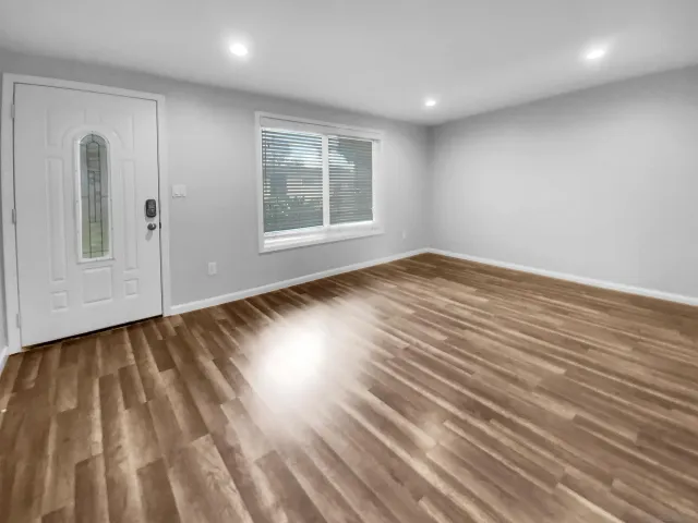 a kitchen with a sink a stove and cabinets