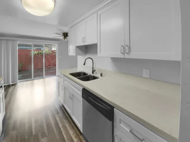 a kitchen that has a lot of cabinets in it