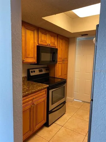a kitchen with a stove and a microwave