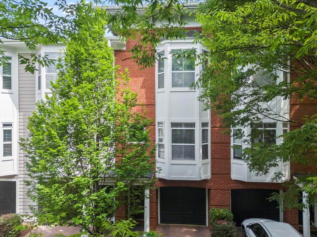 780 Inman Mews Drive Northeast Atlanta, GA 30307 - Photo 1 of 1 a view of a building with a tree