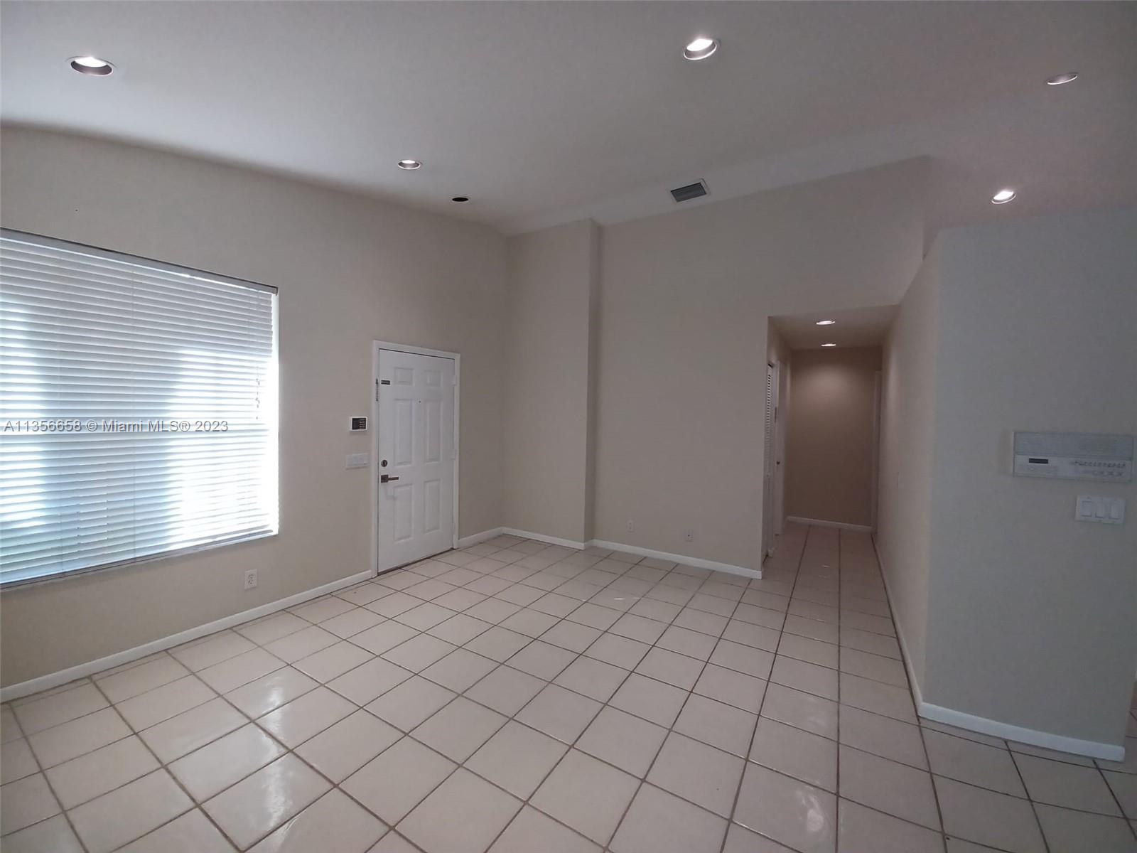 680 Falling Water Road Weston, FL 33326 - Photo 15 of 37 a view of an empty room and window