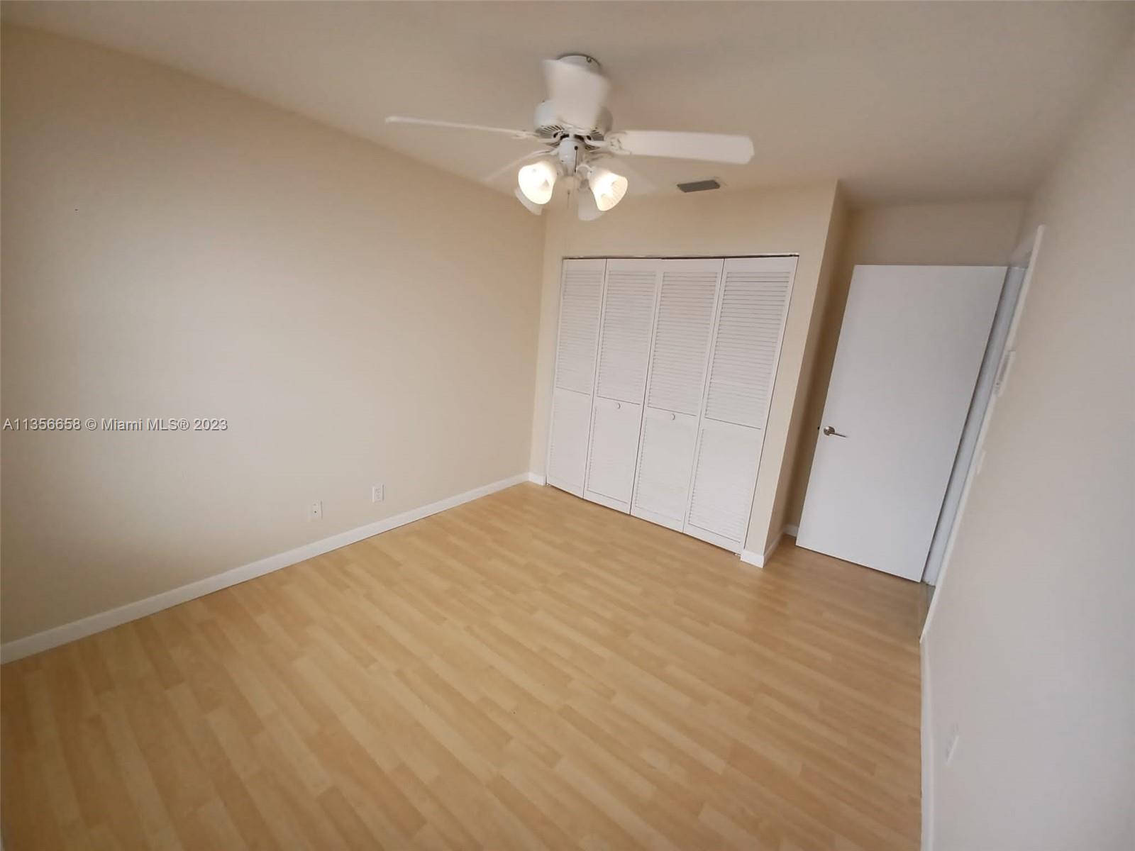 680 Falling Water Road Weston, FL 33326 - Photo 23 of 37 wooden floor in an empty room