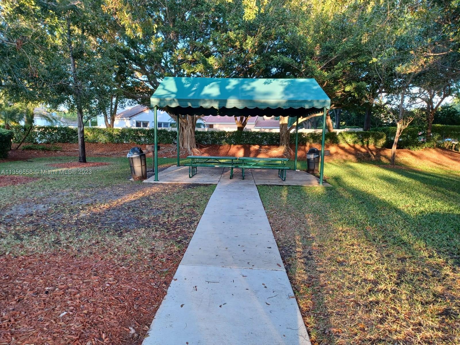 680 Falling Water Road Weston, FL 33326 - Photo 32 of 37 a view of a park with large trees