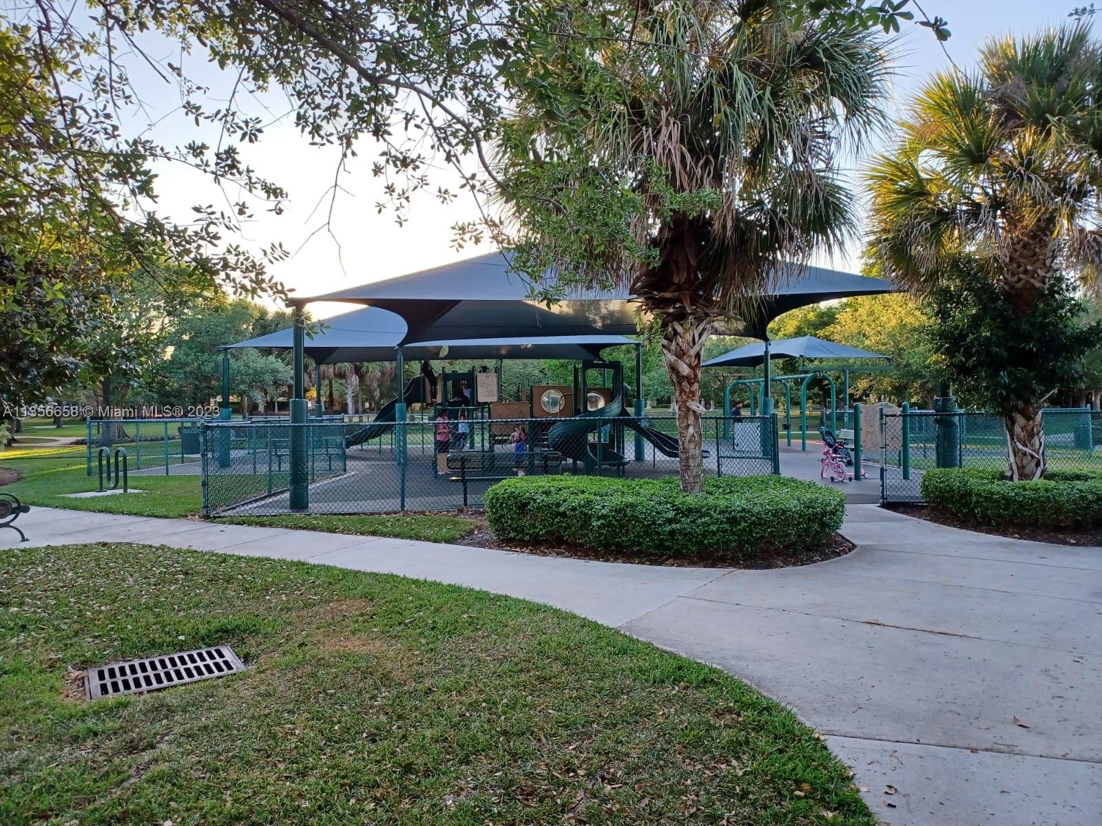 680 Falling Water Road Weston, FL 33326 - Photo 35 of 37 a view of a park with plants and trees