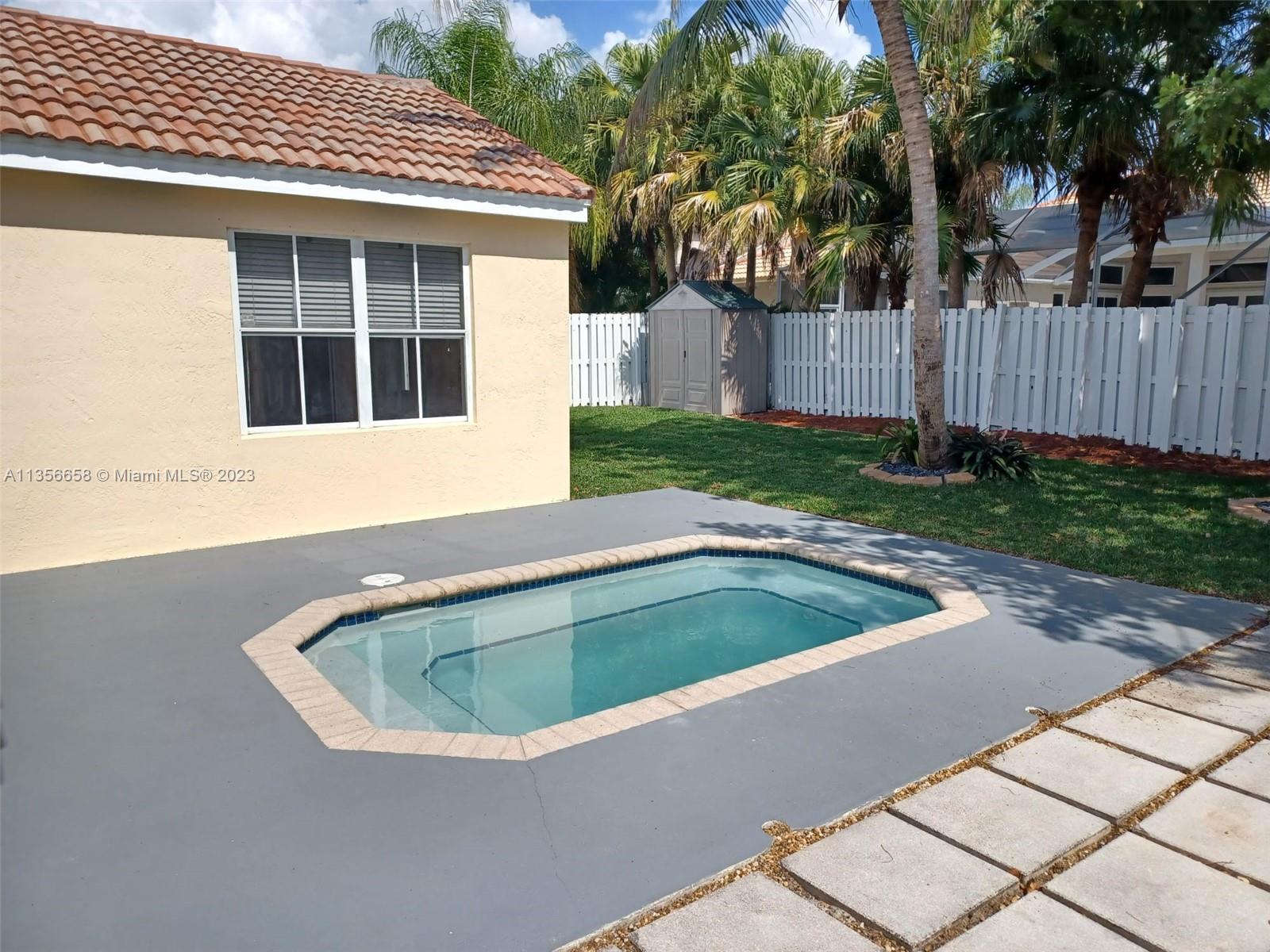 680 Falling Water Road Weston, FL 33326 - Photo 7 of 37 a view of outdoor space yard and swimming pool